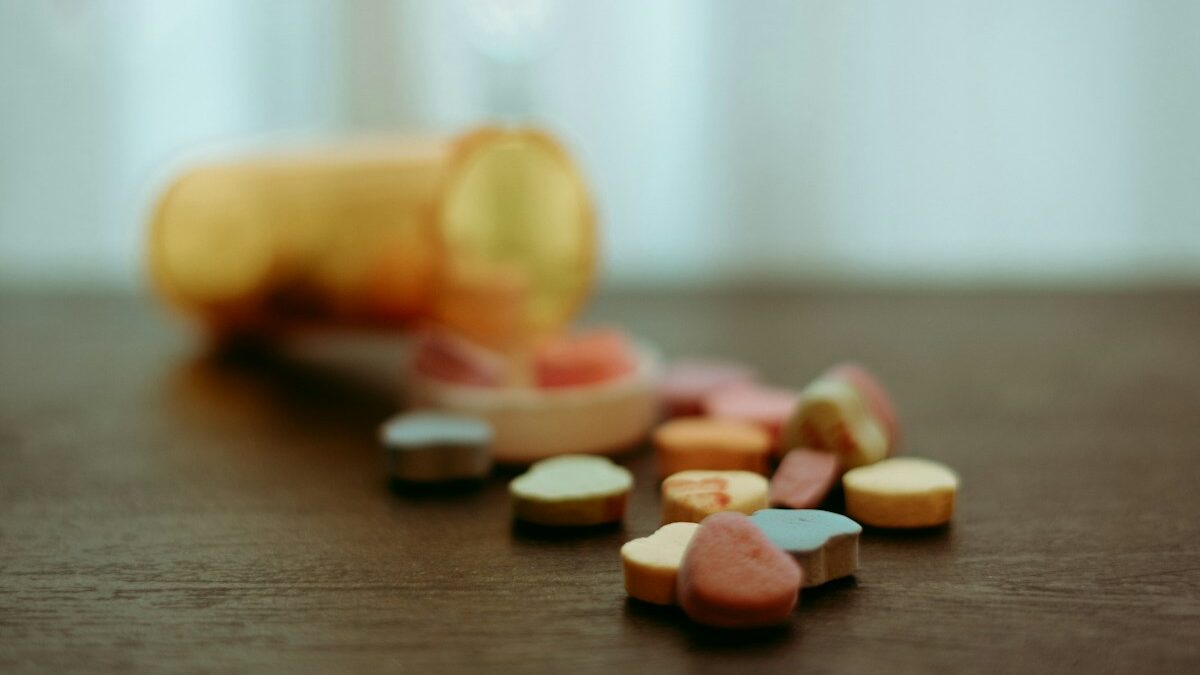 How Long Does Xanax Stay in Your System? Timeline Guide a bottle of pills sitting on top of a wooden table